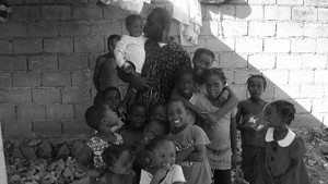 Haitian staff with some of the kids on a work site