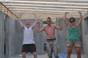 Volunteers raising the roof at Instution Classique