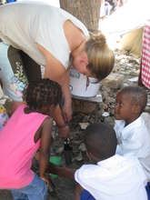 Becca, an EDV volunteer, pouring filtered water