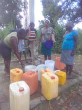 A family in North Haiti pumps Safe & Clean Water!