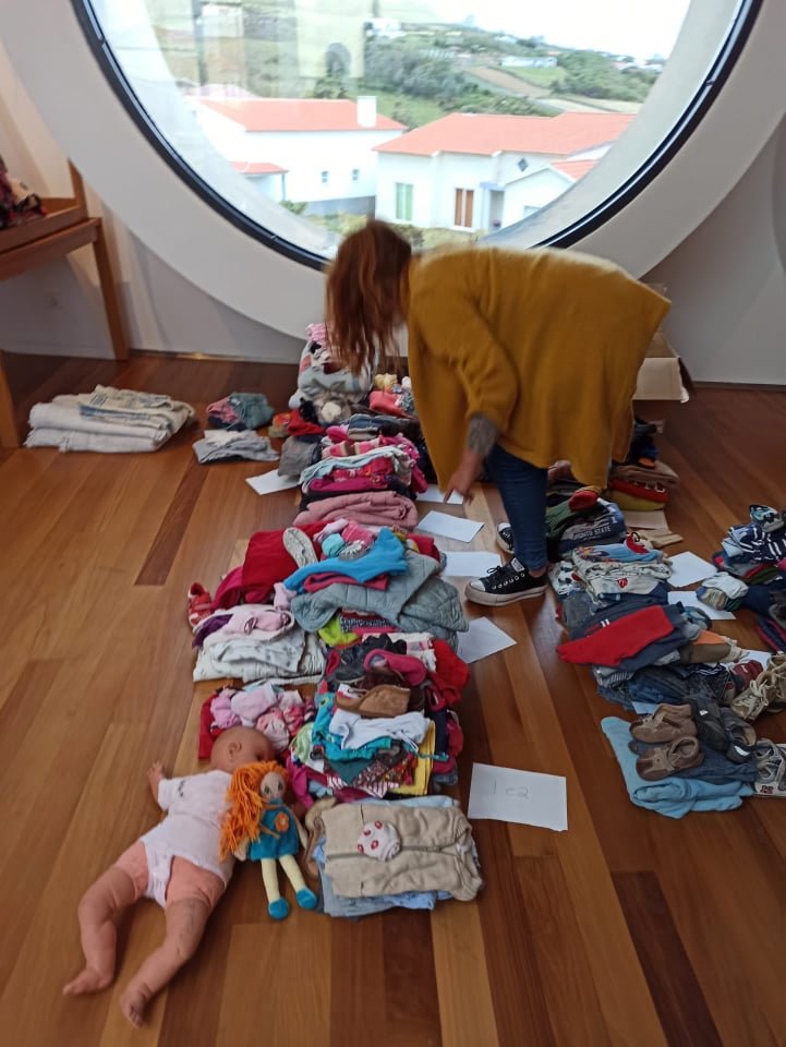 sorting out donated clothes in Azores Island