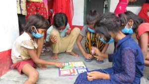 Students learn to play board games during recess.