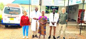 A satisfied patient with dispensary team
