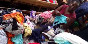 TUSA Member in a market selling clothes