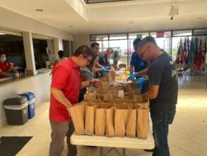 Cummins Volunteers Preparing Food and Clothes