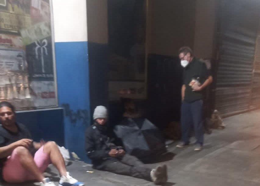 David chatting with some people on the street