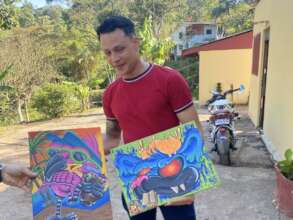 A resident showing his beautiful art