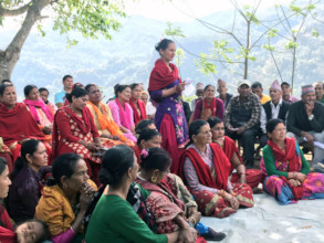 Community members in Nepal meet with EIB mechanism