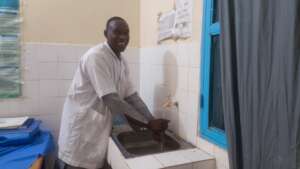 Nurse washing hands in injection room