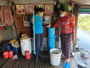 Installing a bio-sand filter in a floating home.