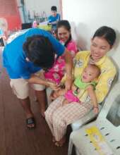 TLC provides vaccine to a child.