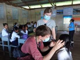 Drs. Helle and Erland from Norway at a school.