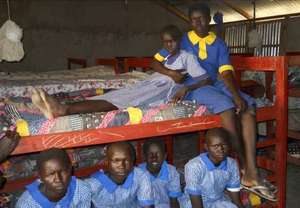 Bunk beds and schoolgirls with new uniforms