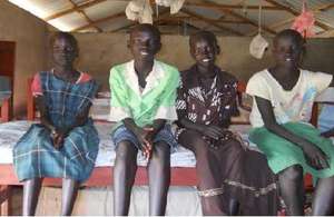 Four girls sitting on bunk bed