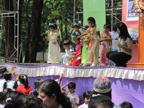 Performers collect flowers from adoring audience