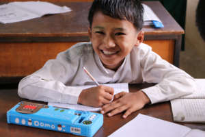 Happy & Proud: Burmese Student on a School Bench