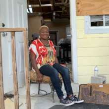 Pleasant in her home at Marsh Harbour, Abaco