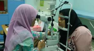 Aminah is having her eyes checked