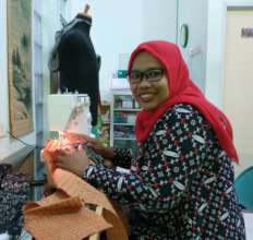 Aminah with new glasses with better sight