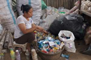 She Sorts Plastic Cups