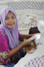 Aryuni at Her Sewing Machine