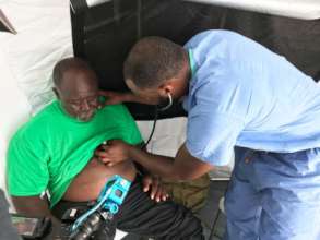 Dr. Myron attending to a High Rock resident.