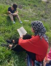 Children reading on the grass, Thiva