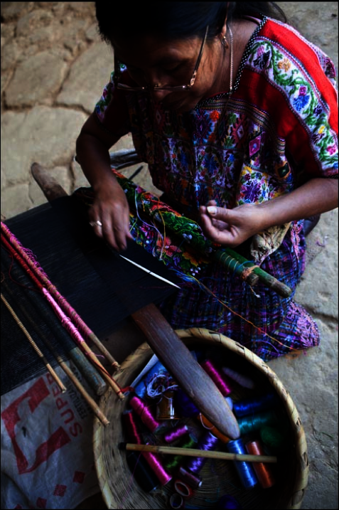Natalia prepares threads for the loom