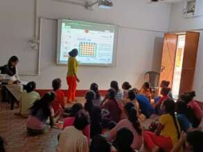 A KGBV Champion teaching about menstrual cycles