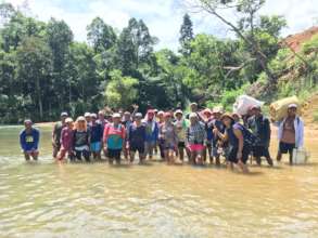 Locals have to cross a river to reach the site.