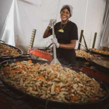 WCK Relief Team member cooks in our field kitchen