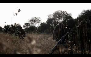 Armed rangers in the field.