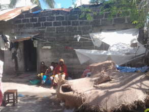 Vulnerable women infront of their house at Majohe
