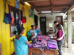 Women artisans showing their products