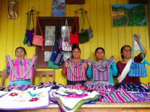 Female weavers showing their work