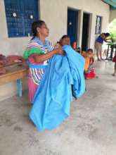 Woman working fabric to make clothes