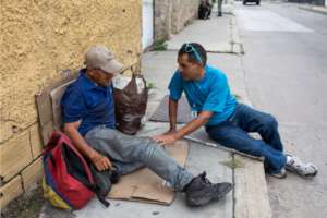 Homeless man speaking to Panabus Street Mediator