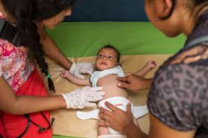 Panabus giving medical care to a newborn