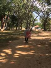 Community member bringing plastic