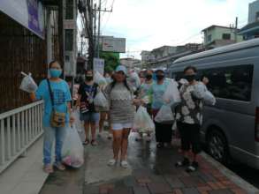 Women coming to pick up food