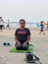 Meditating on the beach early in the morning.