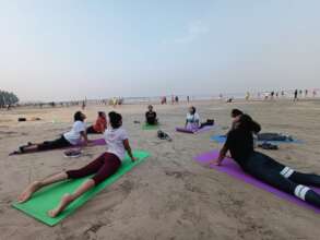 Krantikaris doing Yoga on the beach in Mumbai.