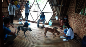 KIDS AT WORK WITH EXCITED ONLOOKERS
