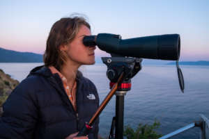 Lighthouse Relief spotting volunteer scans the sea