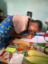 A woman learns to sign her name in Aftercare