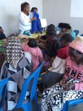 One of our coordinators, Jeni, teaching the women