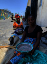 Sisters making baskets.