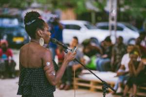Valerie recites a poem at Nafasi in June