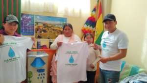 A family poses with their new biosand water filter