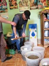 Daniel prepares to load the grades of filter sand